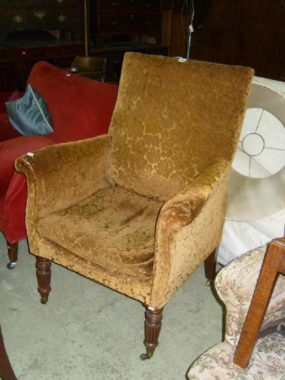 Appraisal: A Regency mahogany armchair with shaped and rolled arms with