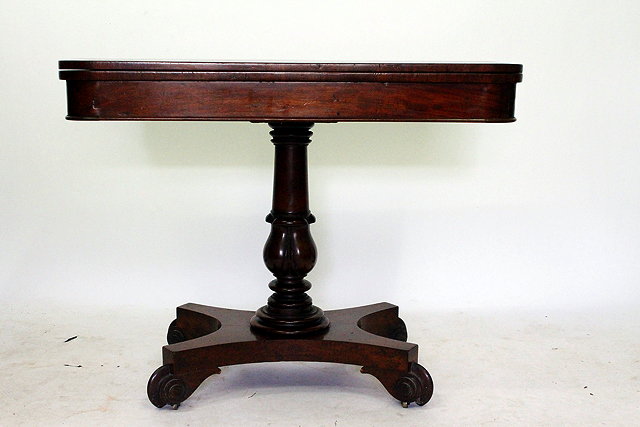 Appraisal: A REGENCY MAHOGANY FOLD OVER TEA TABLE on quadrapartite base