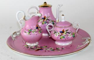 Appraisal: Floral porcelain tea set Floral porcelain tea set charger small