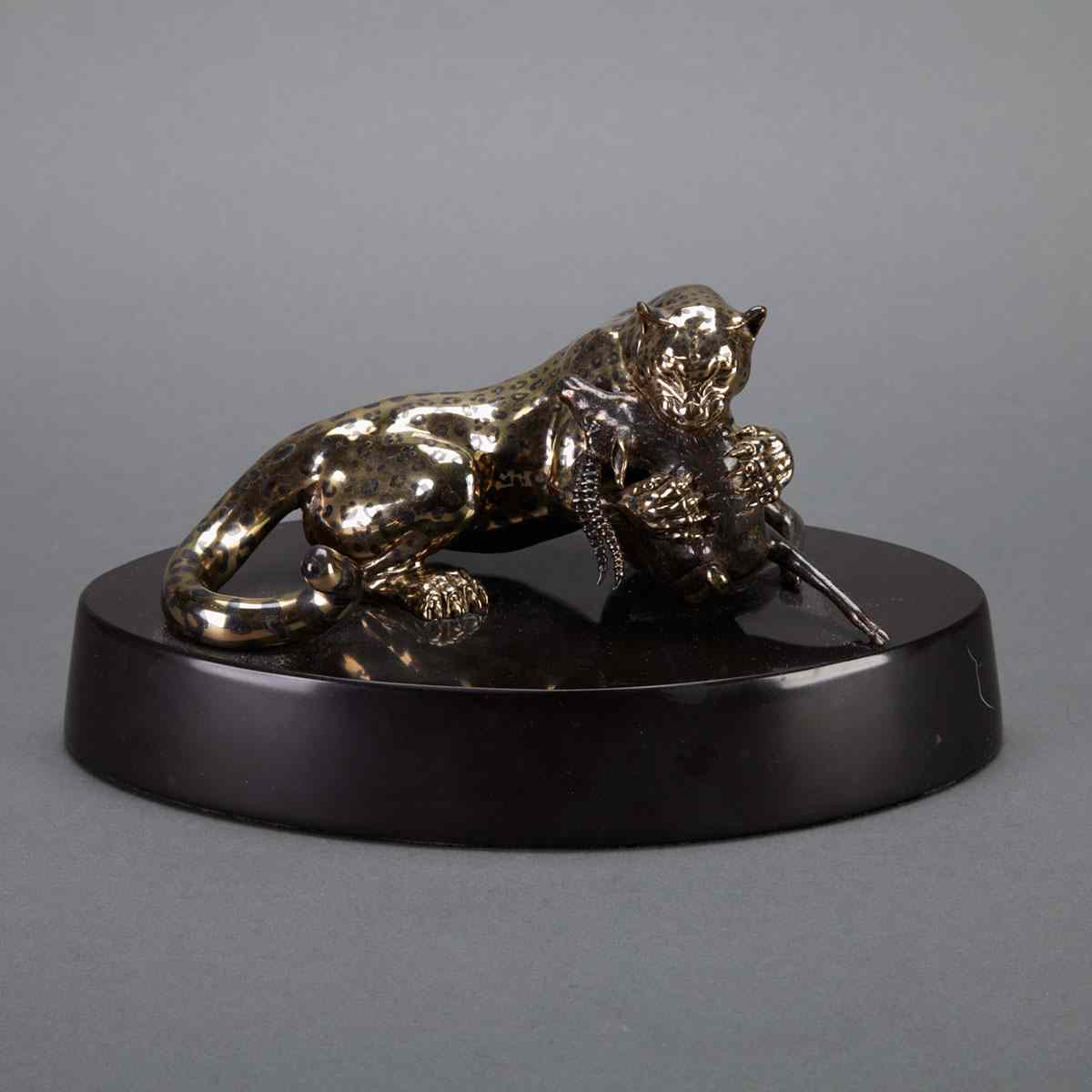 Appraisal: Gold Inlaid Bronze Group of a Cheetah Devouring a Gazelle