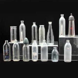 Appraisal: Group of Fourteen Nursing Bottles first half th century clear