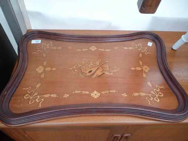 Appraisal: A MAHOGANY RECTANGULAR TRAY with waisted sides and musical instrument