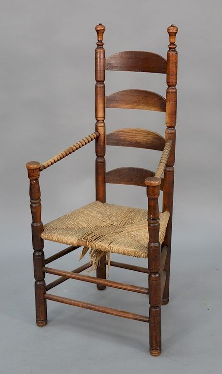 Appraisal: Primitive ladder back great chair with rush seat legs ended