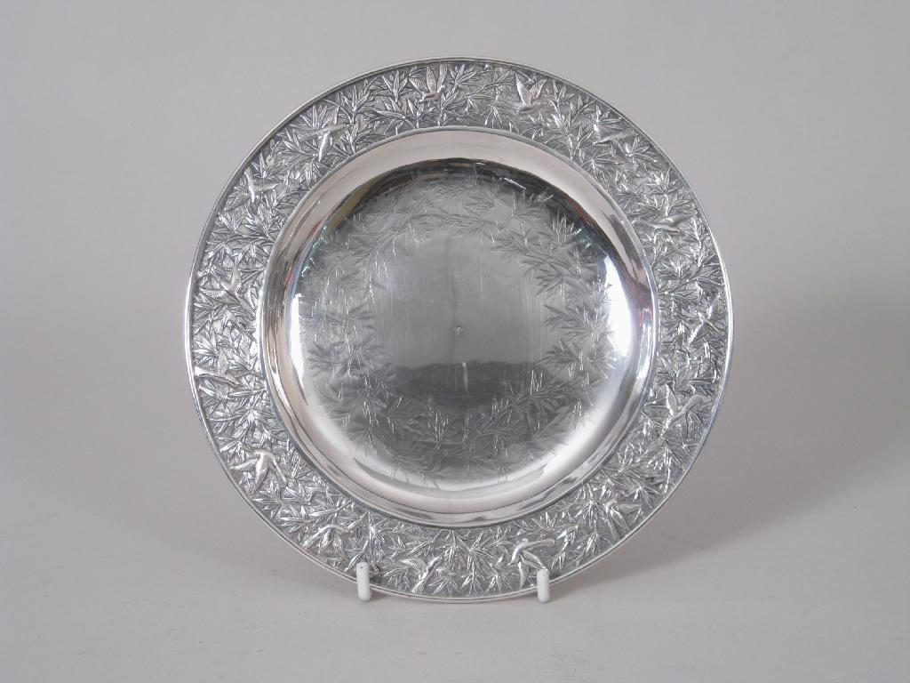 Appraisal: A Chinese silver circular Dish embossed chased and engraved birds