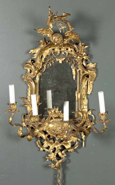 Appraisal: Rococo style gilt-metal four-light mirrored sconce electrified Estimate - All