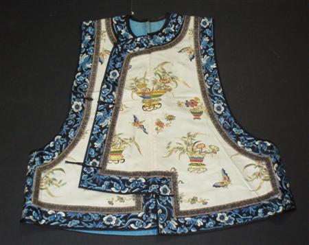 Appraisal: A Chinese embroidered silk waistcoat and skirt the waistcoat decorated