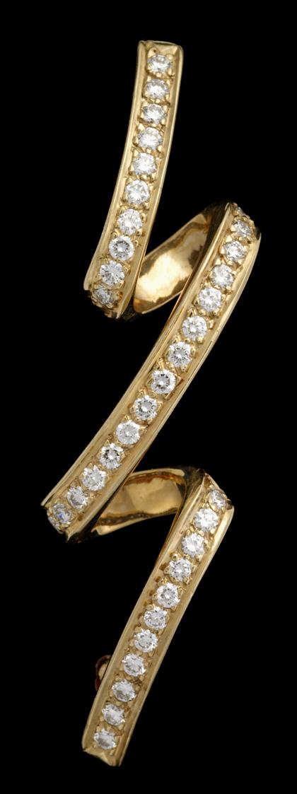 Appraisal: karat yellow gold and diamond ribbon brooch DanknerFree form ribbon