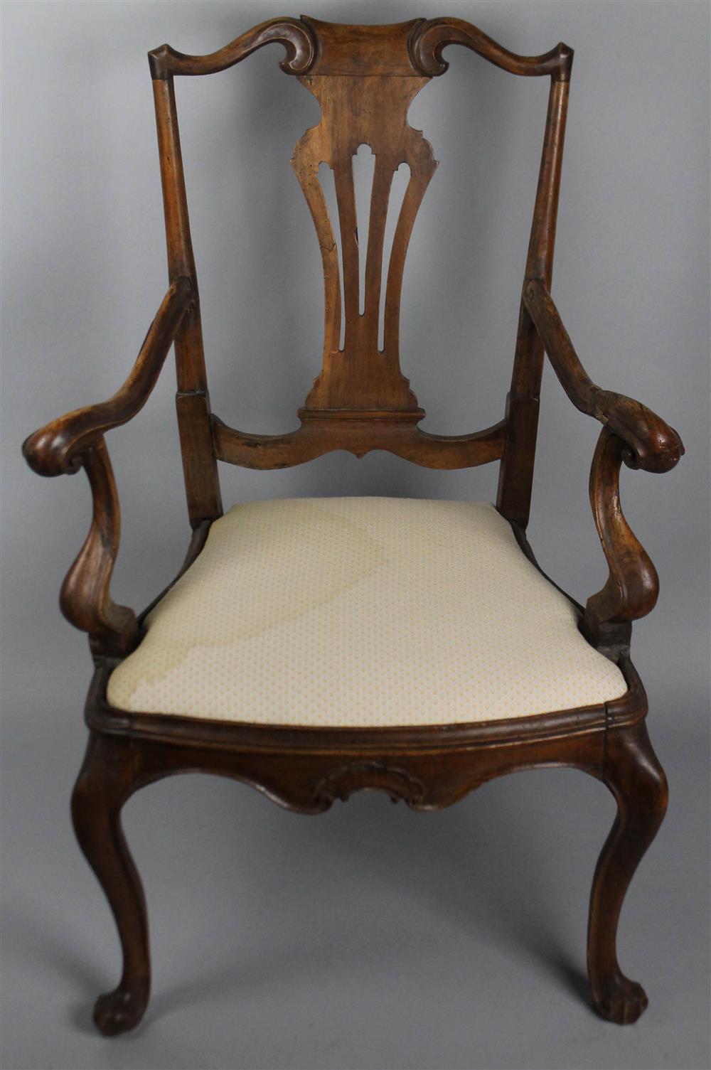 Appraisal: QUEEN ANNE STYLE CARVED ARM CHAIR having an arched and