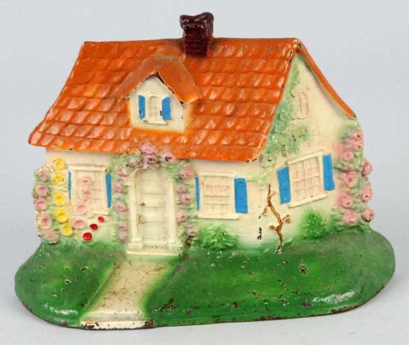 Appraisal: Cast Iron Cape Cod Cottage Doorstop Description Made by Hubley