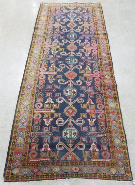 Appraisal: SEMI-ANTIQUE PERSIAN TRIBAL AREA RUG geometric and curvilinear decoration elements