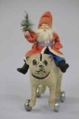 Appraisal: SANTA RIDING POLAR BEAR PULL TOY Germany Santa with a