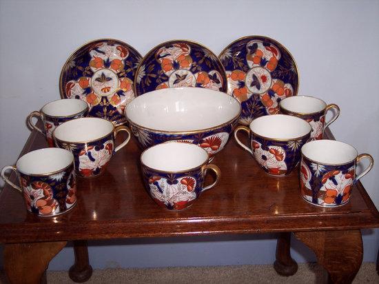 Appraisal: Four Staffordshire coffee cans circa painted flowers in the Imari