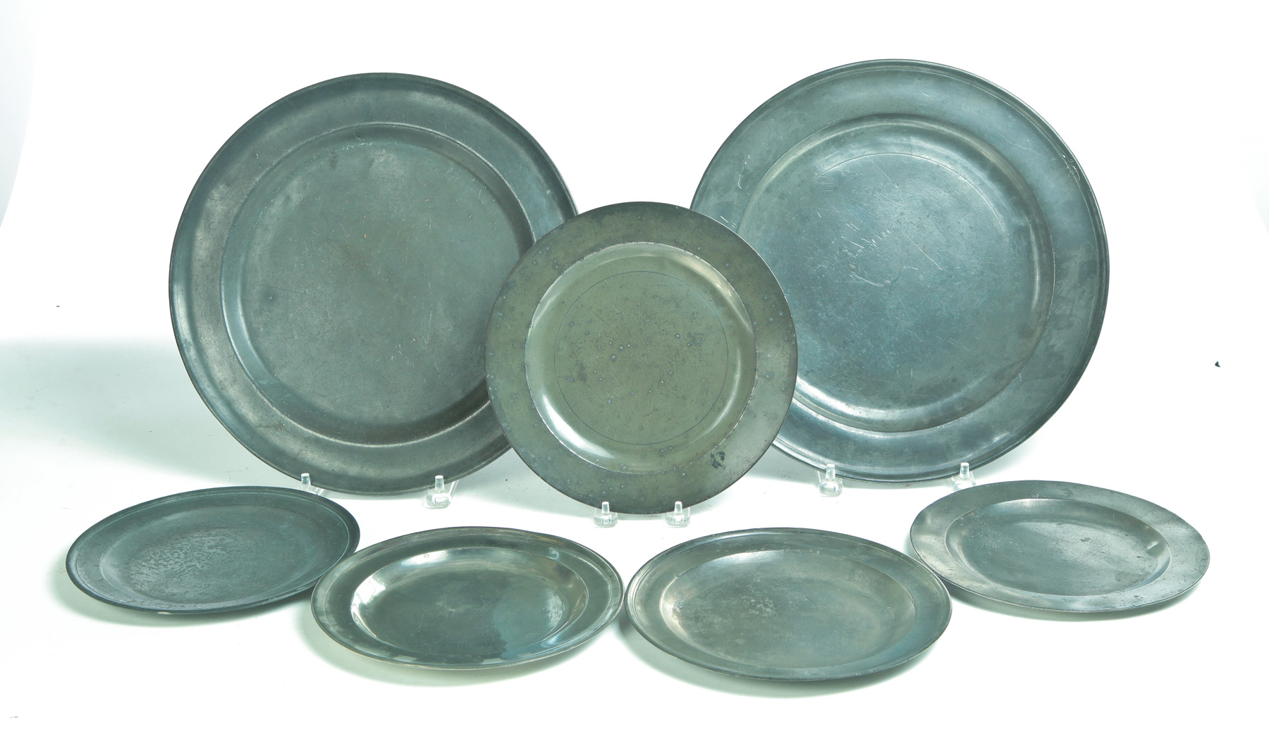 Appraisal: SEVEN ENGLISH PEWTER PLATES AND CHARGERS Late th-early th century