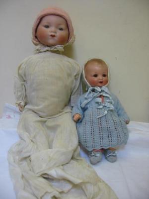 Appraisal: An Armand Marseille bisque head baby doll with blue glass