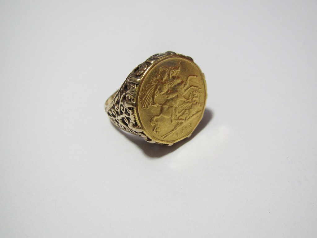 Appraisal: A gold half sovereign ring in a pierced open scroll