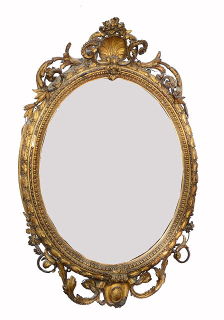 Appraisal: A VICTORIAN GILT GESSO OVAL HANGING WALL MIRROR with open