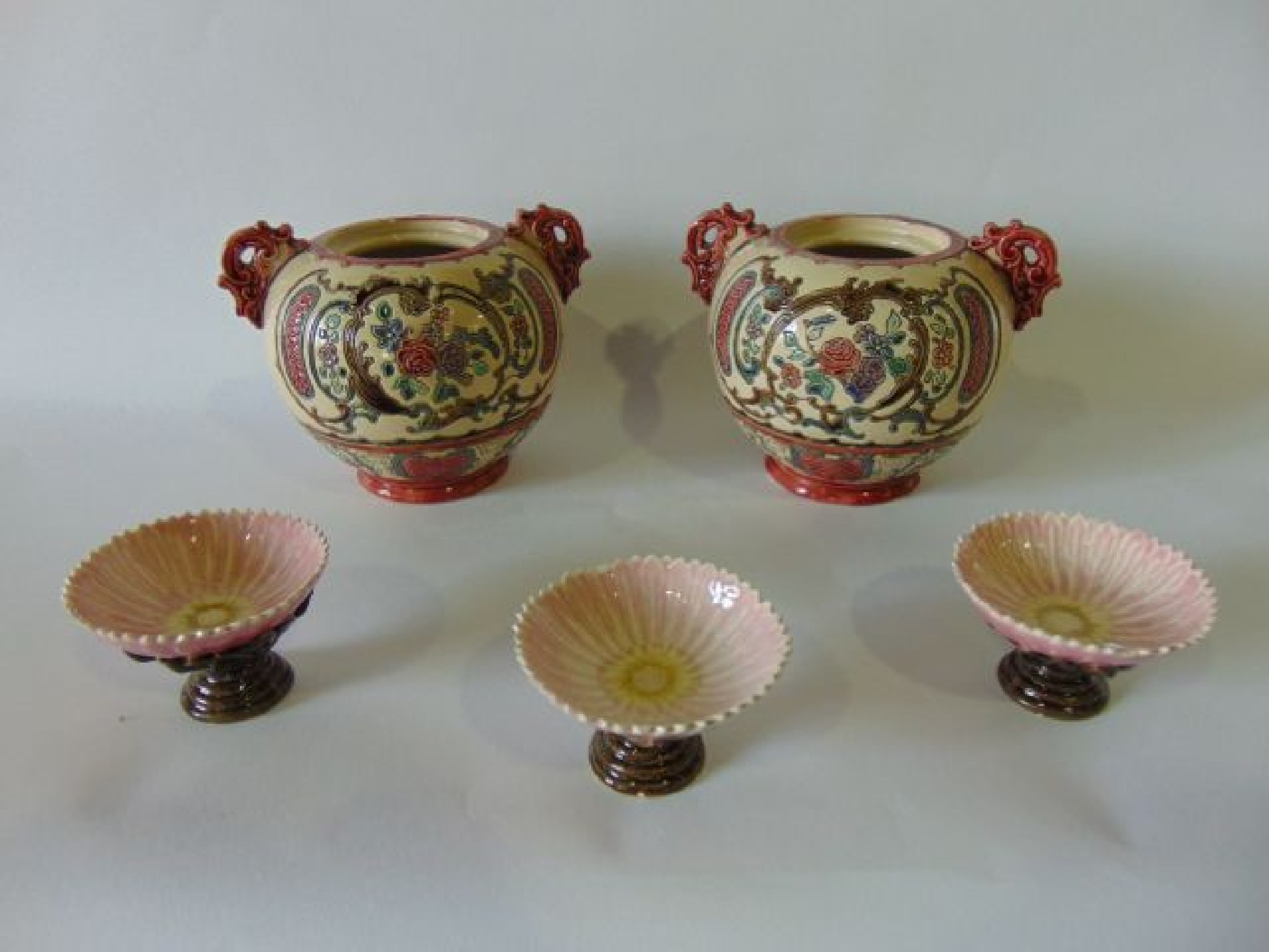 Appraisal: A pair of late th century German majolica two handled