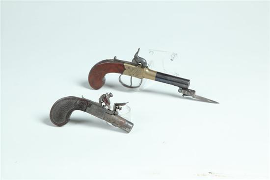 Appraisal: TWO PISTOLS London and Paris th century Brass frame percussion