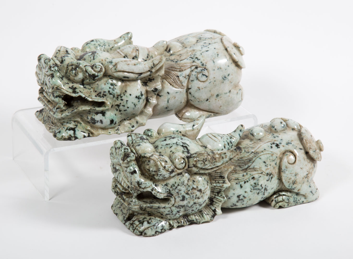 Appraisal: Pair of Chinese carved jade or hardstone dragons in L