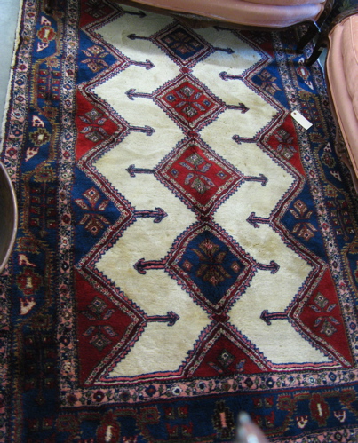 Appraisal: PERSIAN KOLYAI CARPET having a plain ivory field decorated with