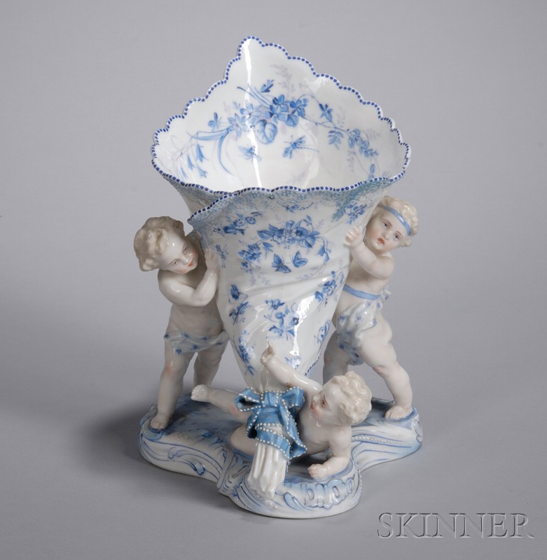 Appraisal: Hand-painted and Enamel Decorated Porcelain Figural Group Vase with Cherubs