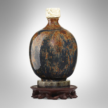 Appraisal: Maurice Gensoli BOTTLE WITH STAND France c carved and glazed