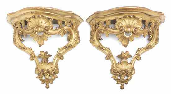 Appraisal: A Pair of Italian Baroque Style Giltwood Wall Brackets having