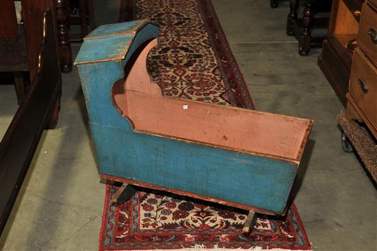 Appraisal: PAINT DECORATED CRADLE American th century Blue painted hooded cradle