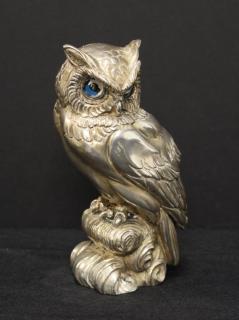 Appraisal: Silver Over Alabaster Sculpture of an Owl The bird depicted