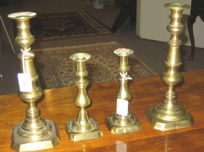 Appraisal: TWO PAIR ENGLISH BRASS CANDLESTICKS Mid th century turned baluster