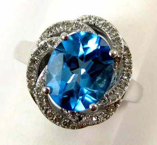 Appraisal: BLUE TOPAZ AND DIAMOND RING k white gold with pave'