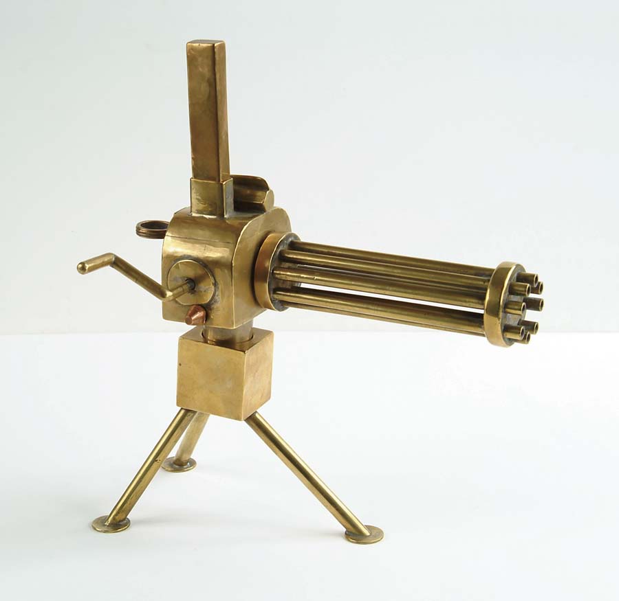 Appraisal: MINIATURE MODEL OF A GATLING GUN Constructed of brass copper