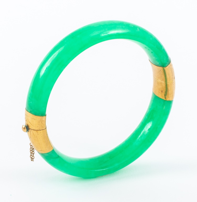 Appraisal: K YELLOW GOLD JADE BANGLE Green jade bangle with K