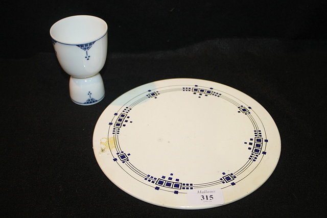 Appraisal: A SECESSIONIST CIRCULAR CERAMIC STAND decorated with blue square motifs