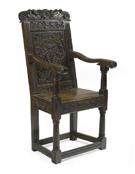 Appraisal: A th century Scottish carved and joined oak open armchair