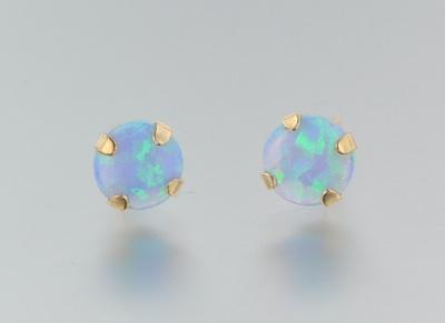 Appraisal: A Pair of Blue Opal Gold Ear Studs A pair