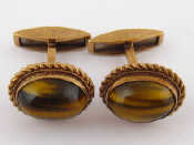 Appraisal: A pair of carat gold tigers eye cufflinks tigers eye