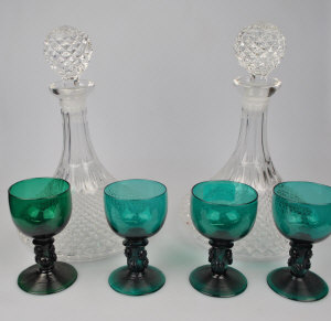 Appraisal: Four th green glass goblets having applied punts to stem