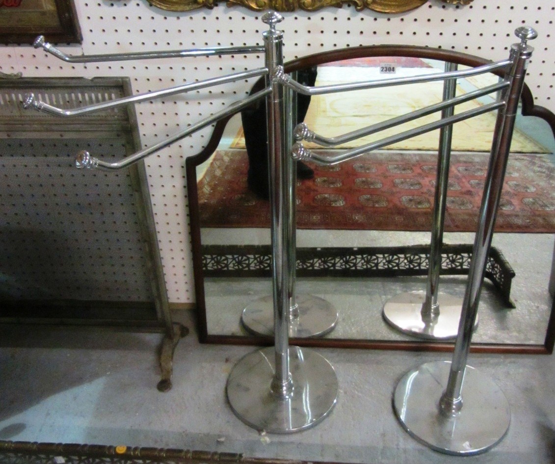 Appraisal: A pair of th century chrome adjustable towel rails