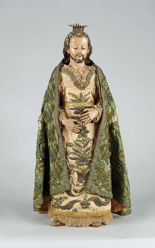 Appraisal: FINE CARVED WOOD AND POLYCHROME CLOTHED SANTOS Figure of a