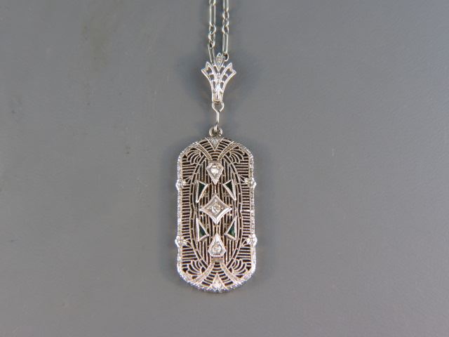 Appraisal: Diamond Filigree Pendant Art Deco diamonds and green stones long