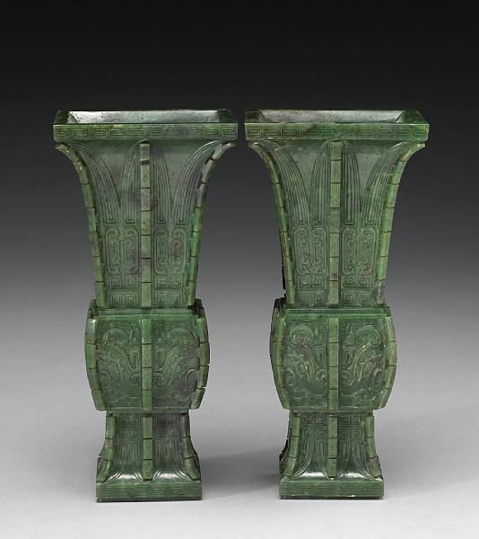 Appraisal: A pair of 'spinach' jade gu-form vases th Century Each