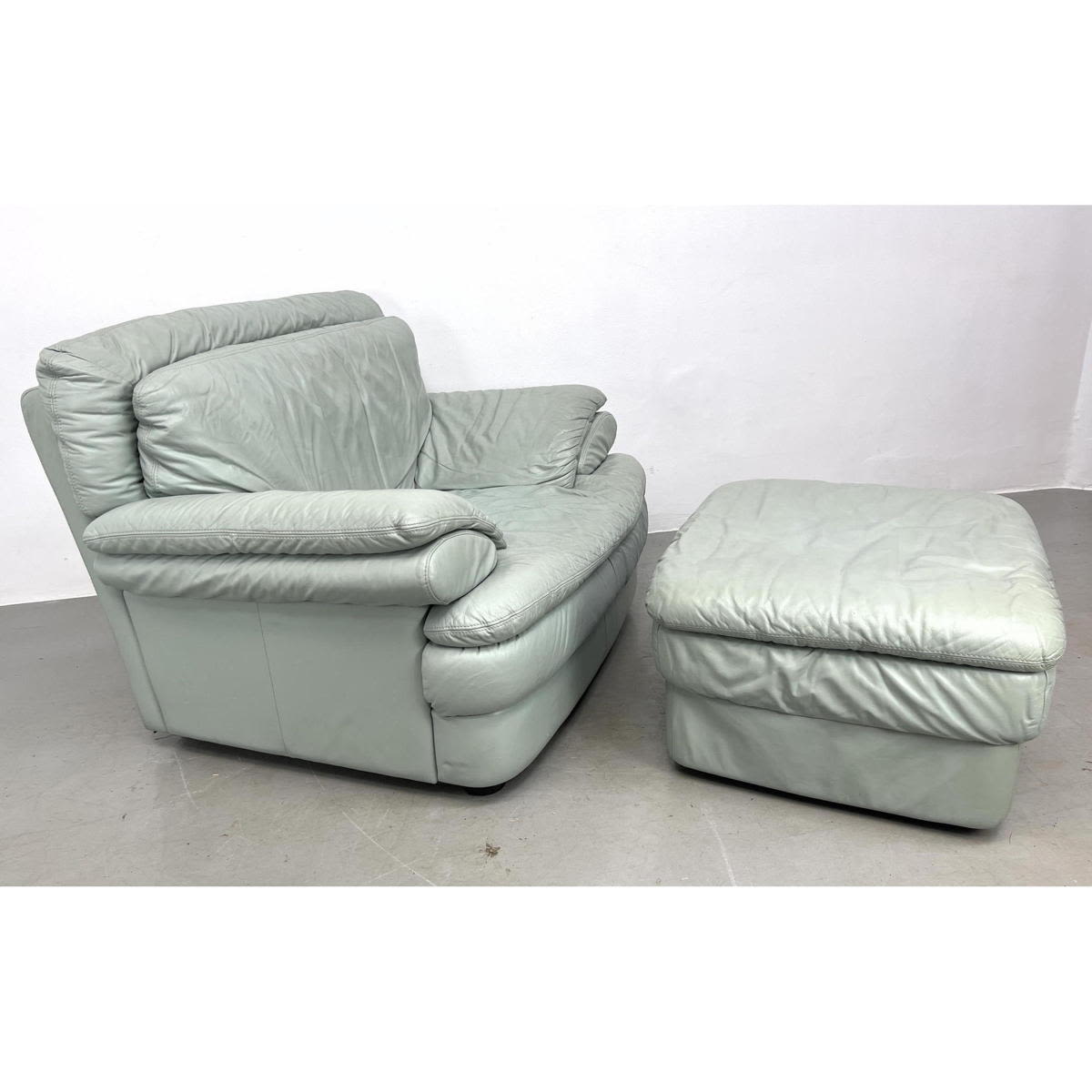 Appraisal: Italian mint green leather lounge chair and ottoman s Dimensions