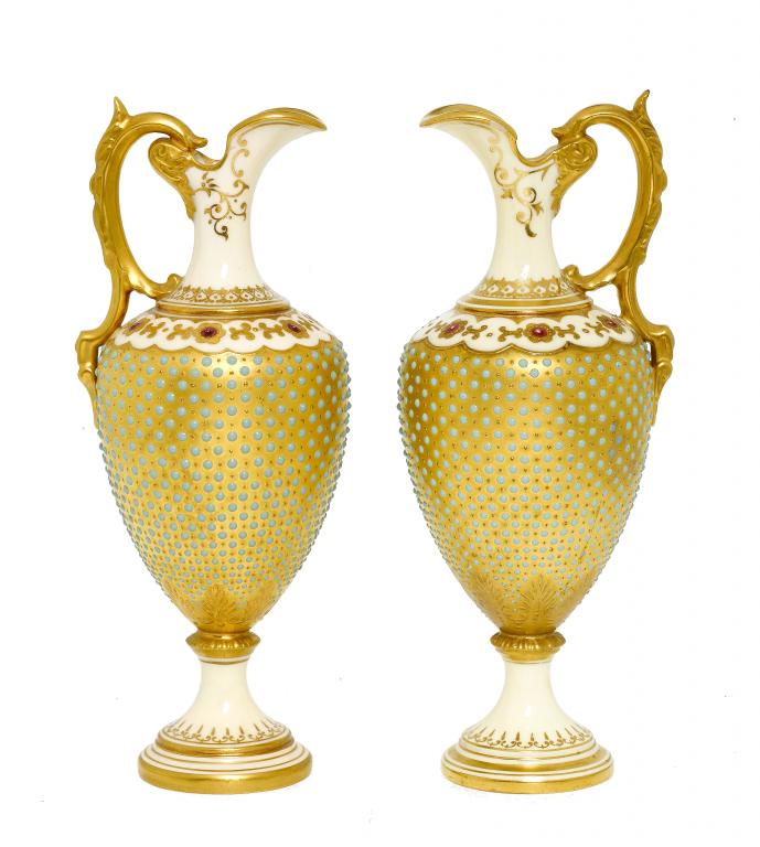 Appraisal: A PAIR OF COALPORT 'JEWELLED' GILT GROUND EWERS of shield