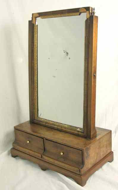 Appraisal: An th Century walnut swing-frame toilet mirror on tapered supports