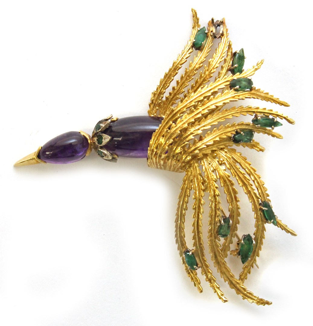 Appraisal: A gold cabochon amethyst and emerald set brooch designed as