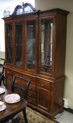 Appraisal: CHIPPENDALE STYLE BREAKFRONT CHINA CABINET ON BUFFET American modern The