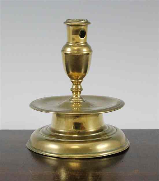 Appraisal: A brass candlestick North West European th century with vase