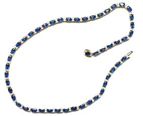 Appraisal: SAPPHIRE DIAMOND AND GOLD NECKLACE K yellow gold necklace designed