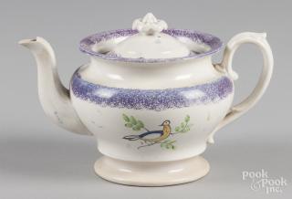 Appraisal: Purple spatter teapot with dove decoration '' h